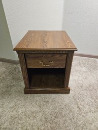 Wooden Nightstand With Golden Accents
