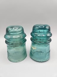 A Pair Of Aqua Blue Glass Insulators