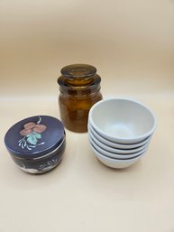 Two Lidded Jars With Small Bowls