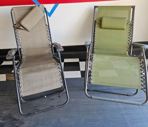 A Pair Of Zero Gravity Lounge Chairs