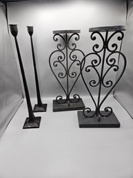 Two Pairs Of Black Candleholders