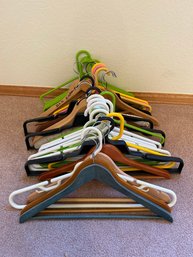Assortment Of Wood And Plastic Hangers