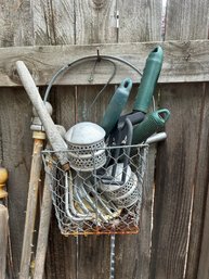 Wire Basket Of Gardening Tools