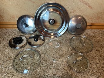 Assortment Of Different Size Lids For Pots And Pans
