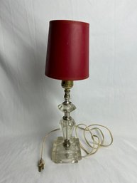 Bedside Lamp With Clear Crystal Look Body And A Red Shade