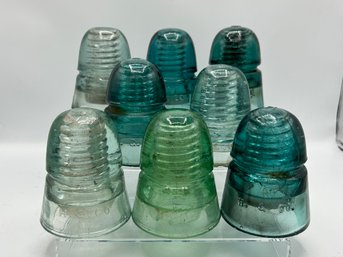 Group Of 8 H. G. Co. Glass Insulators