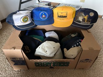 Box Of Trucker Hats And Ball Caps