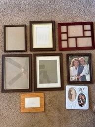 Assortment Of Brown Photo Frames And An Anniversary Frame