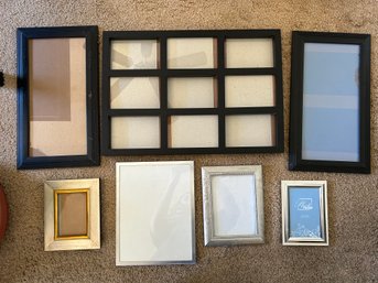 Assortment Of Black And Silver Photo Frames