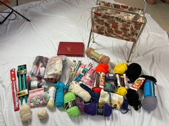 Assortment Of Yarn And Tools With Book