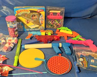 Collection Of Fun Bubble Toys Guns, Slip N Slide, And Bubble Balloons.