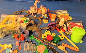 Bundle Of Vintage Toys Featuring An Original Slinky.