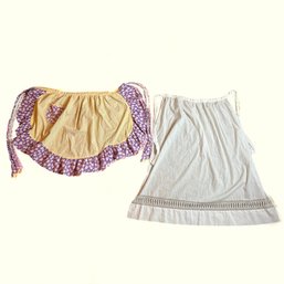 Two Vintage Half Aprons - Long White And Ruffled Edge Yellow And Purple