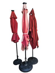 Three Large Red Patio Umbrellas