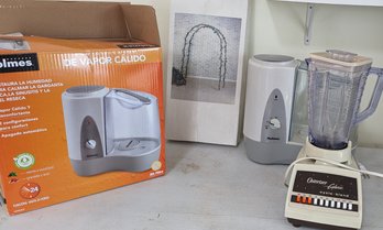 Holmes Warm Mist Humidifier, Vintage Osterizer Blender, And A Iron Garden Arch