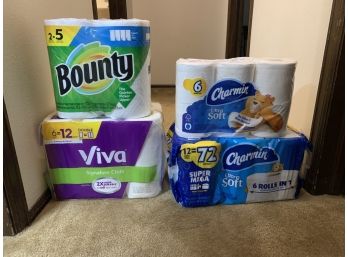 Unopened Packages Of Paper Towels And Toilet Paper