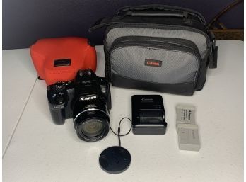 Canon SX50 HS Camera With Rechargeable Batteries, Charger, Protective Cover, And Carrying Bag