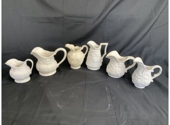 Small White And Alabaster Pitchers