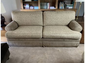 Tan Couch With Leaf Design Cushions