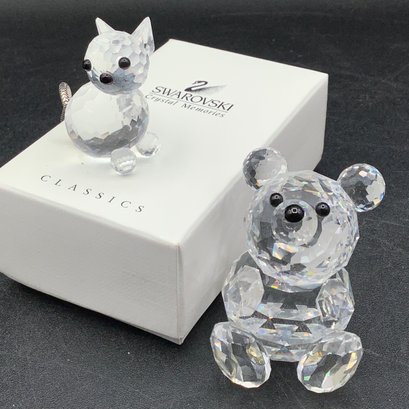 2 Swarovski Crystal Miniatures, Cat With Black Eyes And Silver Tail, Pooh Bear. Both Have Bases, One Box