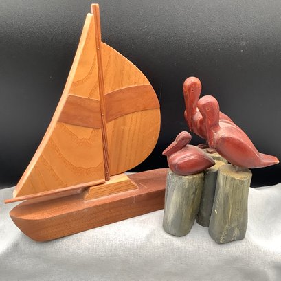 Wooden Nautical Sculptures. Carved Sailboat And Trio Of Pelicans On Pier