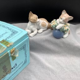 2 Lladro Porcelain Cats, One Reclining, One On A Ball Hugging Delicate Flowers
