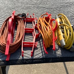 3 Extension Cords And 2 Holder Racks