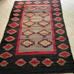 Vintage Navajo Rug, 8' X 5'. Grey Center Field, Black Outer Field With Stepped Medallions In Rust And Reds