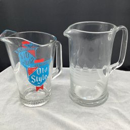 2 Beer Pitchers, One Heileman's Old Syle And One With Etched Ship