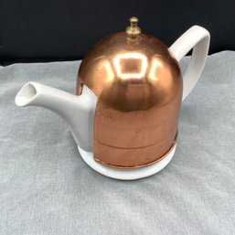 White Ceramic Tea Pot With Copper Tea Cozy