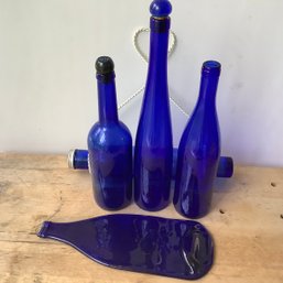 5 Decorative Blue Bottles, One Flattened, One Rolling Pin On Hangar
