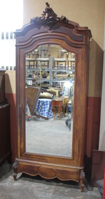 Victorian Walnut Armoire With Ornate Carvings And Beveled Mirror