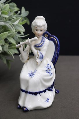 Group Lot Of Small Ceramic Figurines -flute Playing Lady, Horn Playing Kid And 1 Adventurous Boy