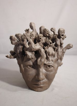 Abstract Sculpture With Expressive Faces