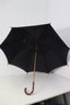 Two Faux Bamboo Handle Umbrellas And A Belmont Park Umbrella