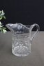 Two Cut Clear Crystal Pitchers, One Is Marked Waterford