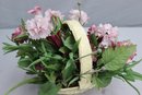 Artificial Flower Bouquet In Faux Woven Acrylic Basket
