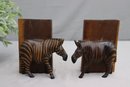 Pair Of Wooden Zebra Leaning On Book Bookends