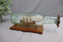 Wooden Ship Constructed In Bottle On Wooden Mount