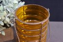 Amber Color  Art Glass Caterpillar Vase Wrapped With Embedded Wire Basket