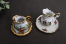 Two Miniature Hand Painted Porcelain Pitchers And Saucers
