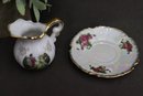 Two Miniature Hand Painted Porcelain Pitchers And Saucers