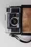 Group Lot Of Vintage Cameras, Flash Cubes, Honeywell Tilt-a-mite Flash Unit, And Spiratone Mini-Strobe
