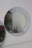 A Pair Of Round Wall Mirrors With Small Mirror Tile Mosaic Border