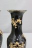 Two Black And Gold Balustrade Vases