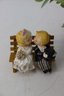 Pair Of Vintage Bride And Groom Sitting On Bench Salt And Pepper Shakers.