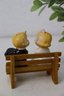 Pair Of Vintage Bride And Groom Sitting On Bench Salt And Pepper Shakers.