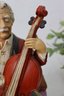 Melody In Motion The Cellist Musician Playing A Bass Violin Figurine Music Box