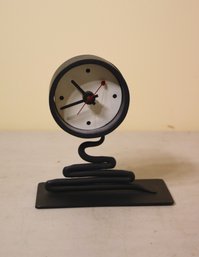 Funky Round Black Clock Perched On Black  Ooze Coil
