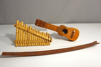 Lot Of 3 Vintage Folk Musical Instruments  Pan Flute, Miniature Guitar, And Stringed Bow